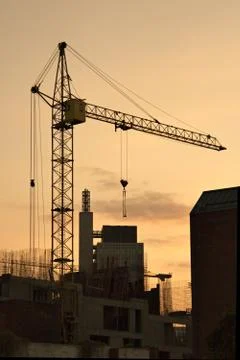 Lifting crane in evening Stock Photos