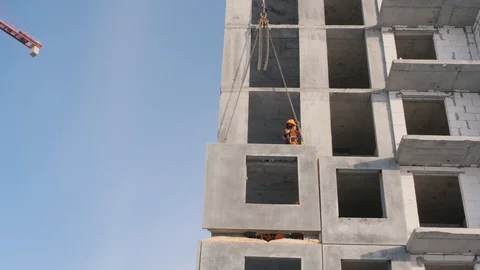 Lifting crane moves wall panel and builders control mounting Video stock 124607878