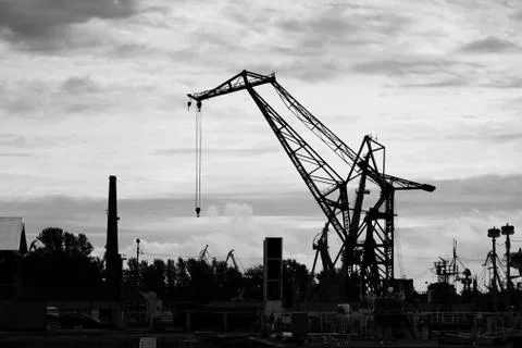 Lifting crane for unloading and loading near the marina for ships in the Gulf Stock Photos
