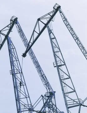 Lifting cranes inversion. Loading and construction. Stock Photos