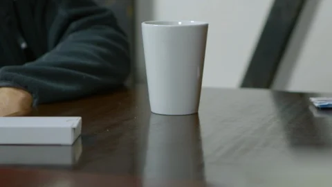 Lifting a cup and taking a sip Stock Footage 124816101