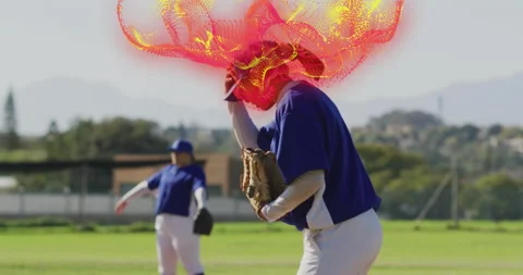 Lifting gaze skyward baseball pitcher crouching on mound generating swirl Stock Footage 314708544