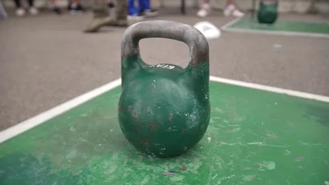 Lifting of large green kettlebell. Video stock 249084417