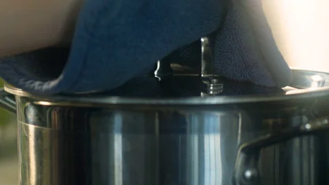 Lifting Lid off pot Stock Footage 94124155