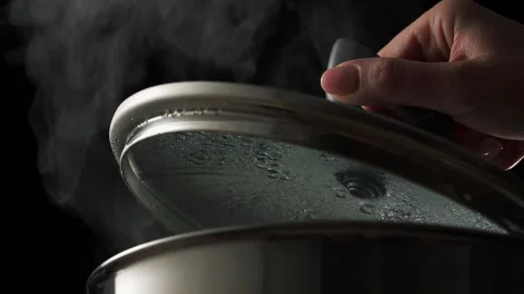 Lifting Lid from Steaming Pot, Cooking Detail. Stock Footage 258622913