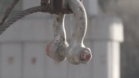 Lifting a metal hook onto a crane, building a bridge Stock Footage 275336374