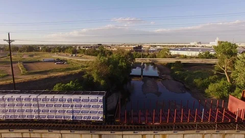 Lifting up over river and bridge Color Corrected Stock Footage 98845357