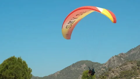 Lifting off on paragliding on beach. Stock Footage 250636759