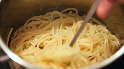 Lifting pasta out of pan Stock-Footage 81268051