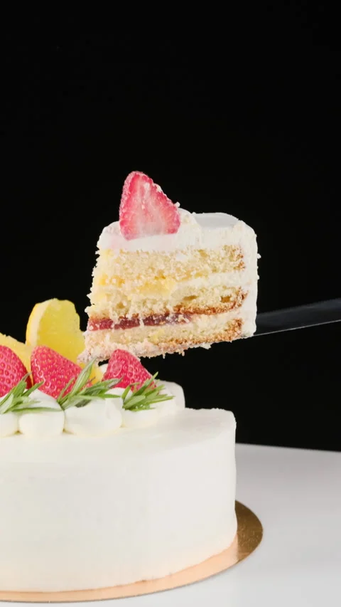 Lifting a piece of strawberry cake on a pastry spatula Stock Footage 302881158