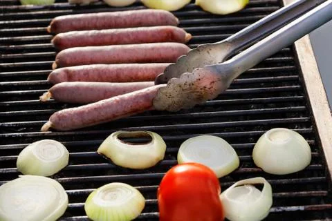 Lifting a sausage Stock Photos