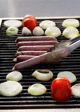 Lifting a sausage Stock Photos