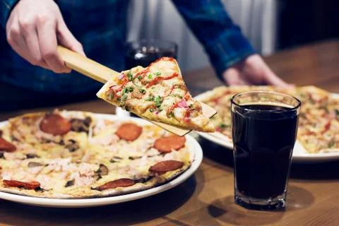 The lifting slice of hot pizza, closeup Stock Photos