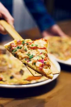 The lifting slice of hot pizza, closeup Stock Photos