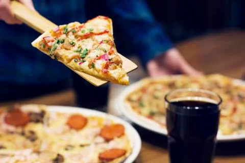 The lifting slice of hot pizza, closeup Stock Photos