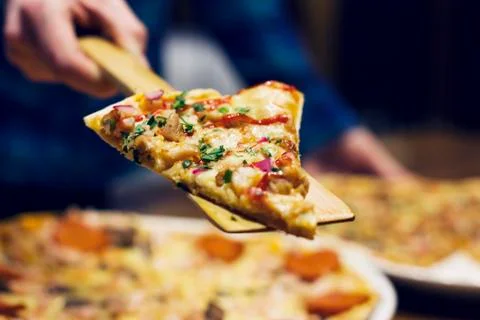 The lifting slice of hot pizza, closeup Stock Photos