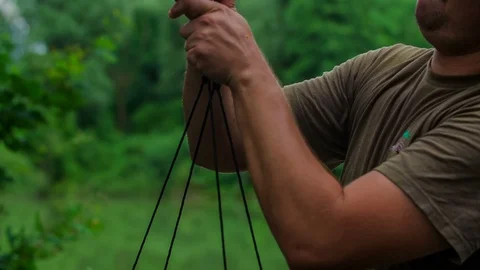 Lifting something up and checking how heavy it is Stock Footage 112178422