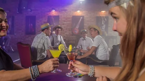 Lifting their glasses up  Stock Footage 112185691