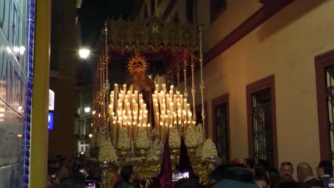 Lifting Virgin Mary Paso During Holy Week Procession at Night Stock Footage 336025188