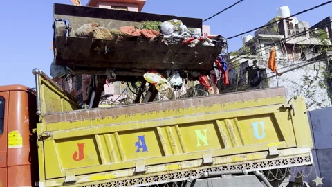 Lifting Waste from Dumping Yard Using JCB Machine Stock Footage 332773640