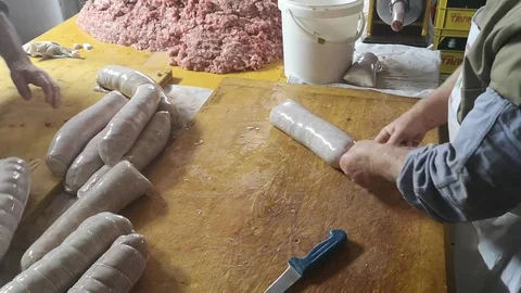 Ligation and processing of fresh salami by the butcher Stock Footage 101054260