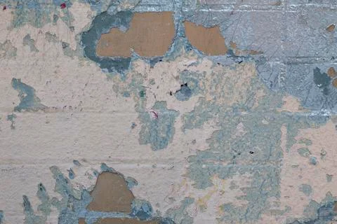 Light abstract background of brick wall with spots and layers of old paint Stock Photos