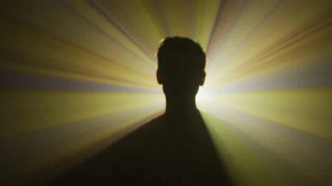 Light abstract projection behind a silhouette Stock Footage 216491998