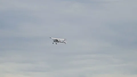 Light aircraft flying in the sky in cloudy weather Stock Footage 119538475