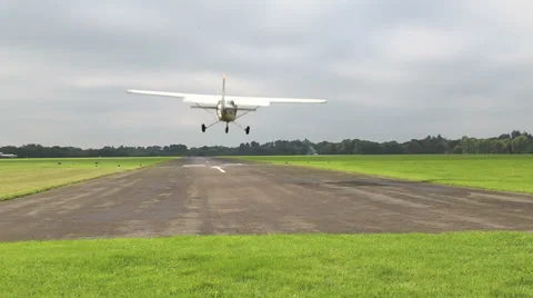 Light aircraft landing Stock Footage 32112459