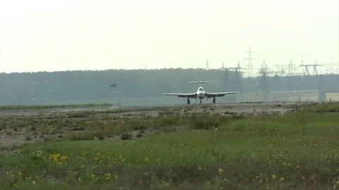 Light aircraft on a runway view Stock Footage 88605424