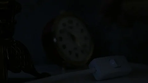 Light off. Alarm clock is set on bed table before light switch is turned off. Vídeos de archivo 72641272