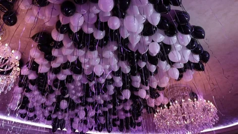 Light and dark balloons on ceiling wide chandelier Stock Footage 91425299