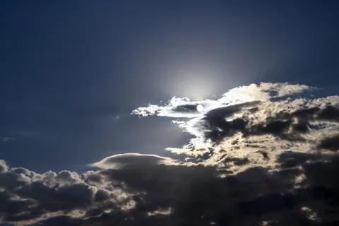 Light and dark clouds and rays of the sun shine through the clouds, a beautiful Foto stock