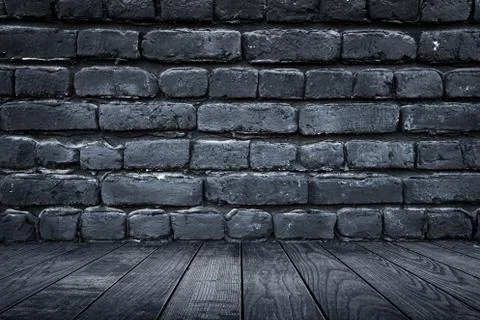 Light and dark gray bricks on the wall and wooden floor decoration for Stock Photos