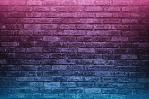 Light and dark gray bricks on the wall decoration with colored led lights for Stock Photos
