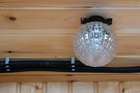 Light and electrical wires on the ceiling. Stock Photos
