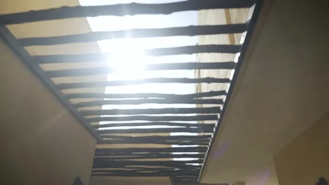 Light and flares cut through the wood of a typical Arabian corridor in Bahrain. Stock Footage 244531257