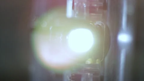 Light and lens of old film projector. Close up lens flare from vintage movie pro Stock Footage 130832860