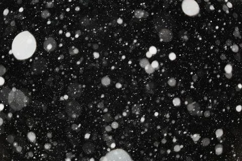 Light and light snowflakes on a dark background. Stock Illustration