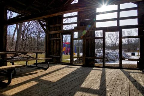 Light and shadow in the damaged barn house with lens flare Stock Photos