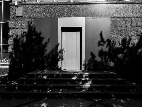 Light and shadow door on the street. Stock Photos