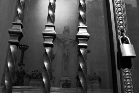 Light and Shadow on a graveyard. A jesus cross. Stock Photos