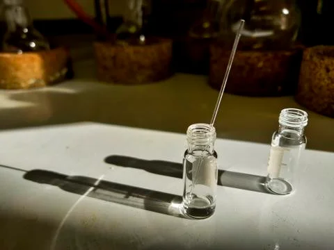 Light and shadow of LCMS vials in a chemical hood along with capillary for TL Stock Photos