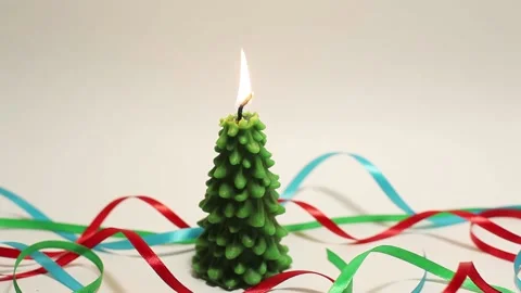 Light and shadow motion of still burning candle in shape of fir tree Stock Footage 143660285