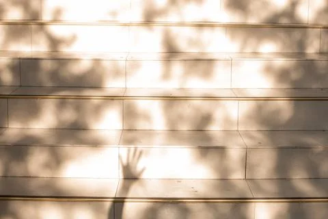 Light and shadow pattern on beige steps, human touch Stock Photos