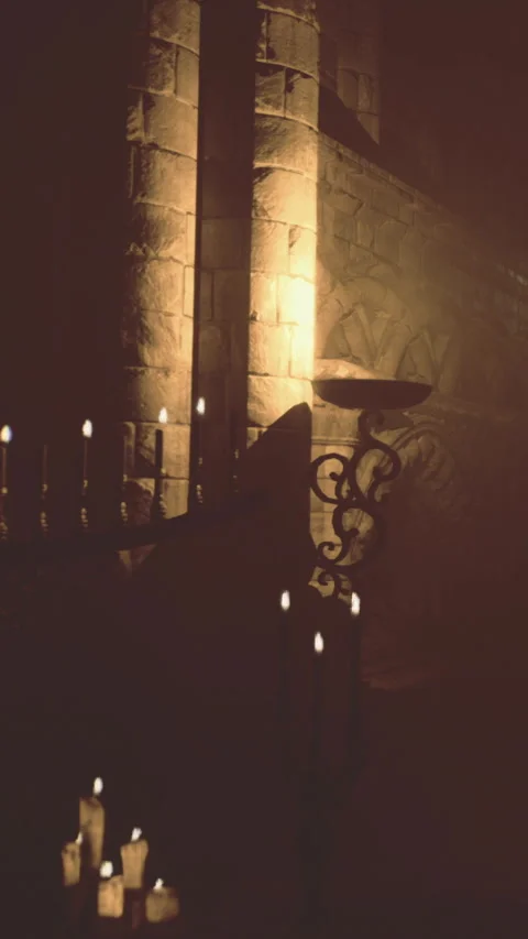 Light and shadow play in a stone structure with candles and decorative features Stock Footage 331368110