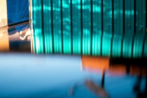 Light and shadow reflected from the car roof looks beautiful and unusual. Stock Photos