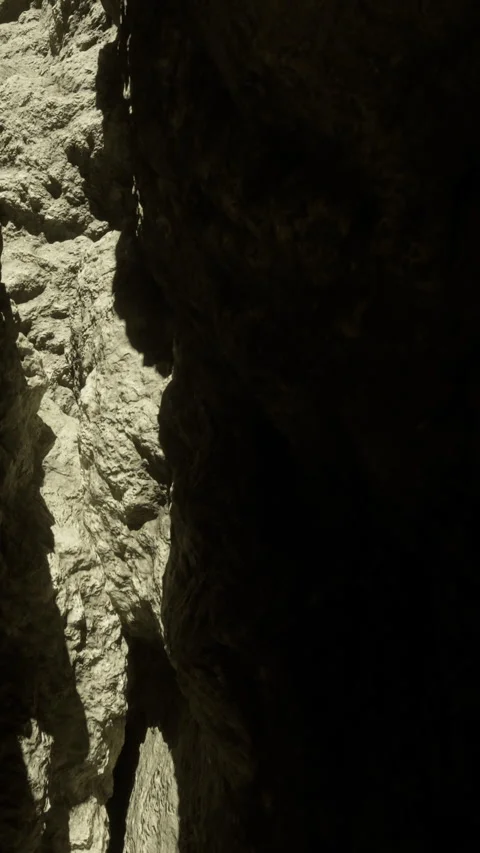 Light and shadow in a rocky gorge at midday Stock Footage 334174496