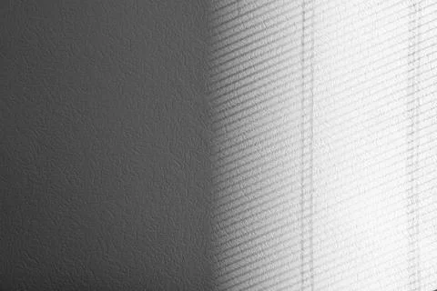 Light and shadow from window on white wall, space for text Stock Photos
