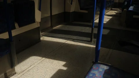Light and shadows alternate on the floor of a riding train. Stock Footage 204098468